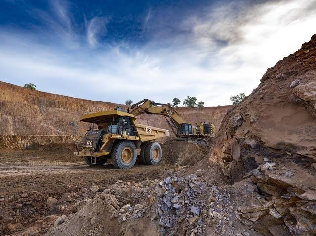 Excavator loading a haul truck