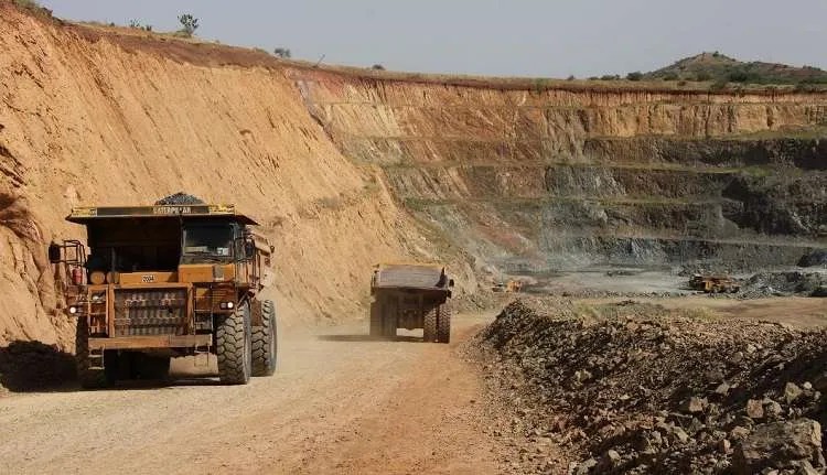 Haul trucks on a mine road
